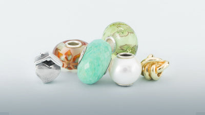 Perles Trollbeads en pierres précieuses, perles, verre, argent et or