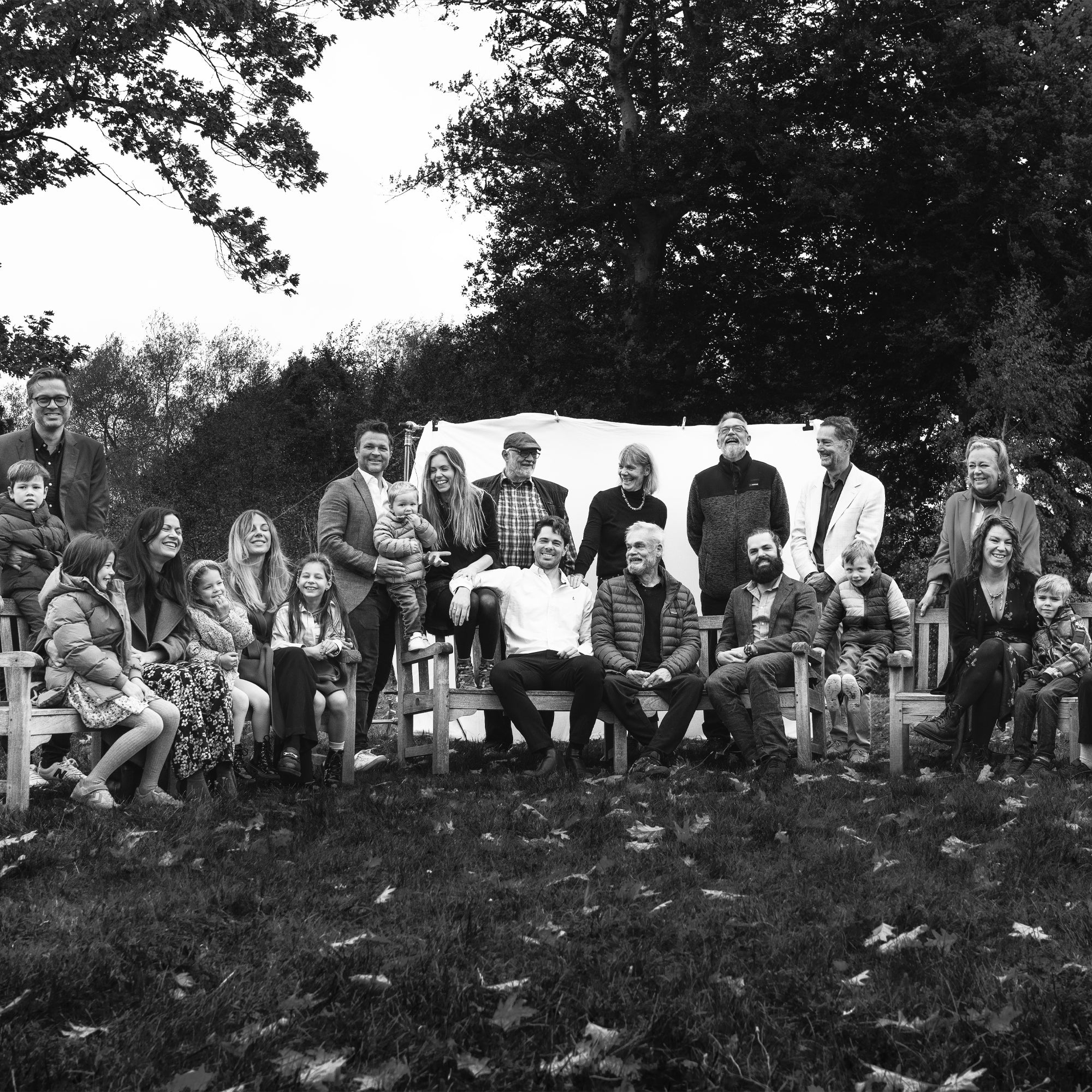 Black and white photo of the Trollbeads family outdoors in a garden